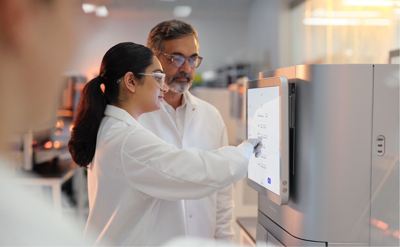 Profile image of male and female scientists reviewing the run setup screen